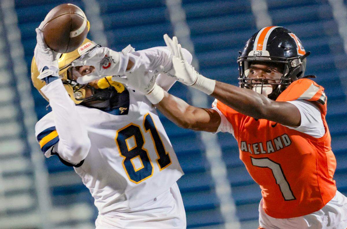 St. Thomas Aquinas wide receiver Julius Jones (81) attempts to catch the ball as pass interference is called on Lakeland Dreadnaughts Kavon McKinney (7) in the first half during the Florida High School Football State Championships - Class 5A game at Pitbull Stadium on the campus of Florida International University in Miami, Florida, on Thursday, December 12, 2024.