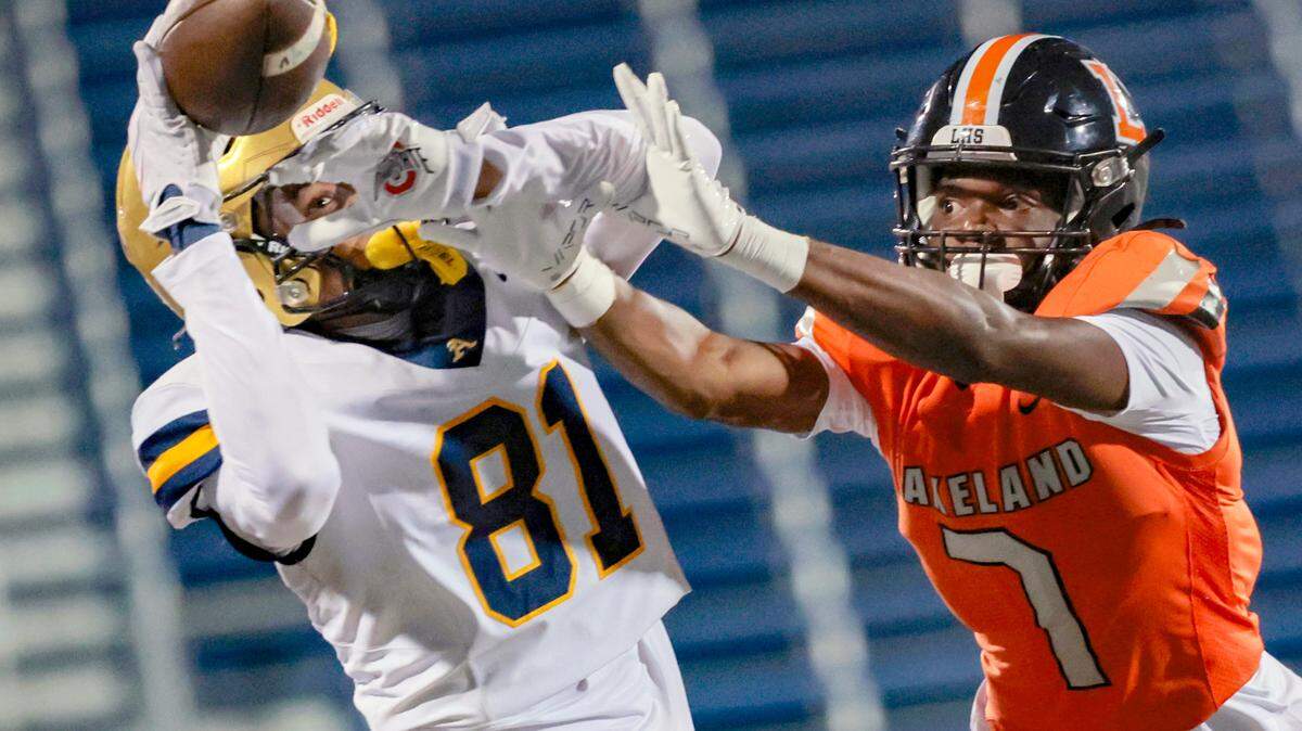 St. Thomas Aquinas wide receiver Julius Jones (81) attempts to catch the ball as pass interference is called on Lakeland Dreadnaughts Kavon McKinney (7) in the first half during the Florida High School Football State Championships - Class 5A game at Pitbull Stadium on the campus of Florida International University in Miami, Florida, on Thursday, December 12, 2024.