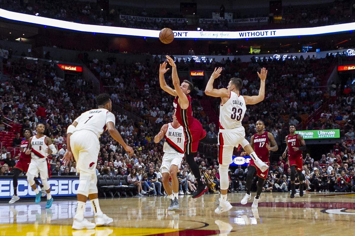 Miami Heat guard Goran Dragic (7) gets fouled in the fourth quarter as the Miami Heat host the Portland Trail Blazers at the AmericanAirlines Arena on Saturday, October 27, 2018.