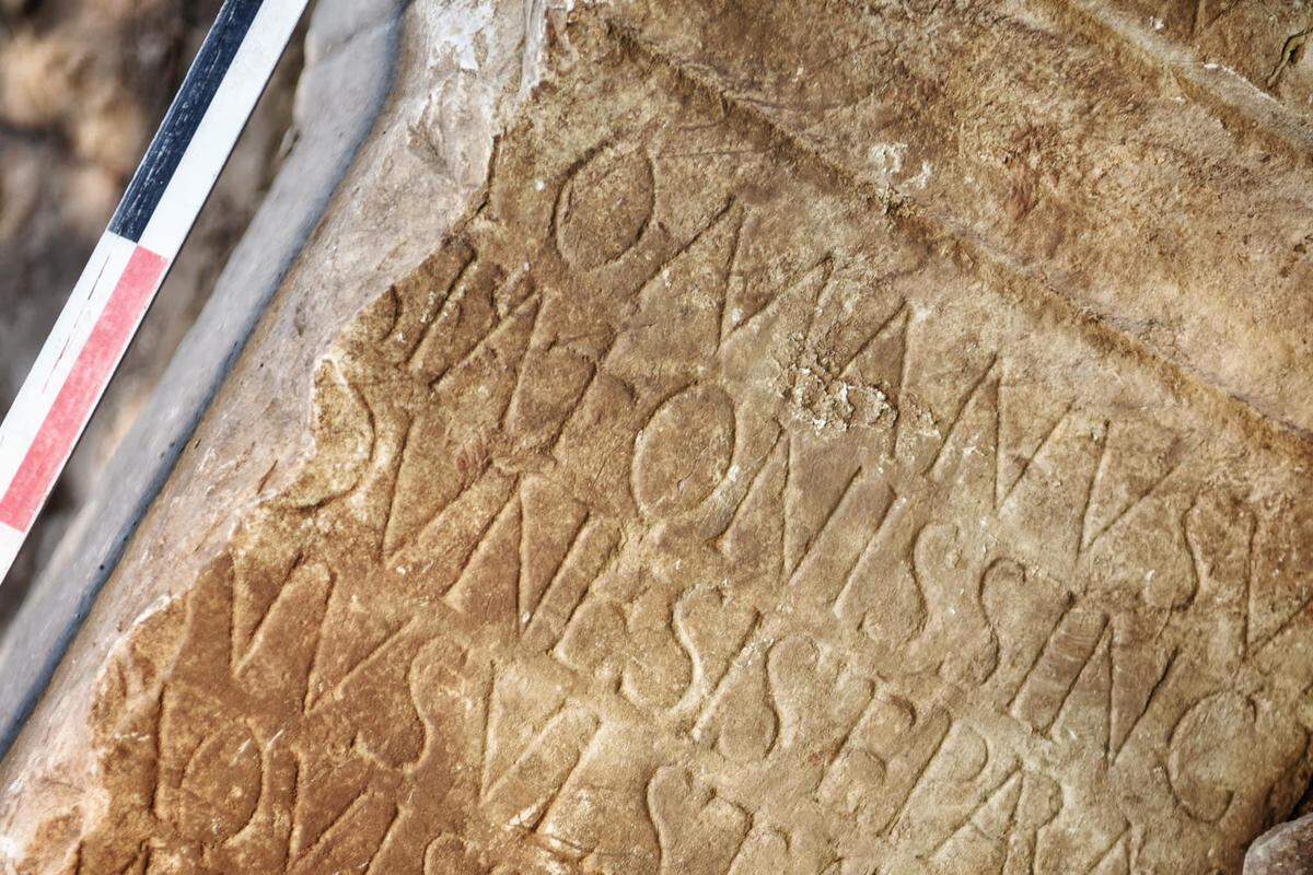 Roman lettering showed the wall stone was once an altar.