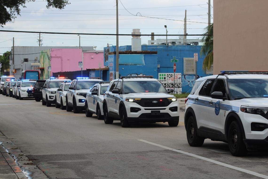 City of Miami police cars are lined up near Jackson Memorial Hospital Tuesday, Oct. 28, 2025, in honor of Miami Beach Police Officer David Cajuso, who died in a motorcycle crash earlier that day on I-75 near Hialeah.