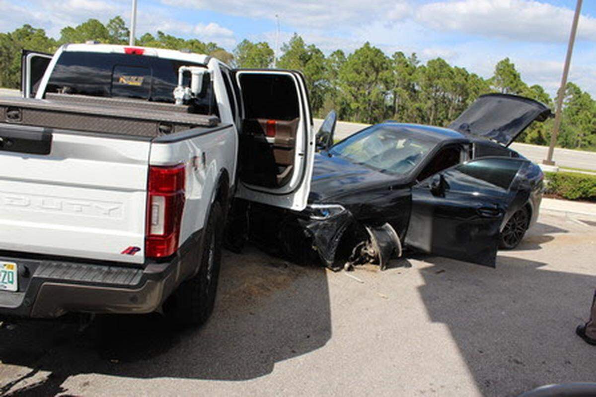The BMW pulled into a 7/11 in Fort Myers, Florida, where it struck a Ford F250 and the driver fled on foot, witnesses told troopers.