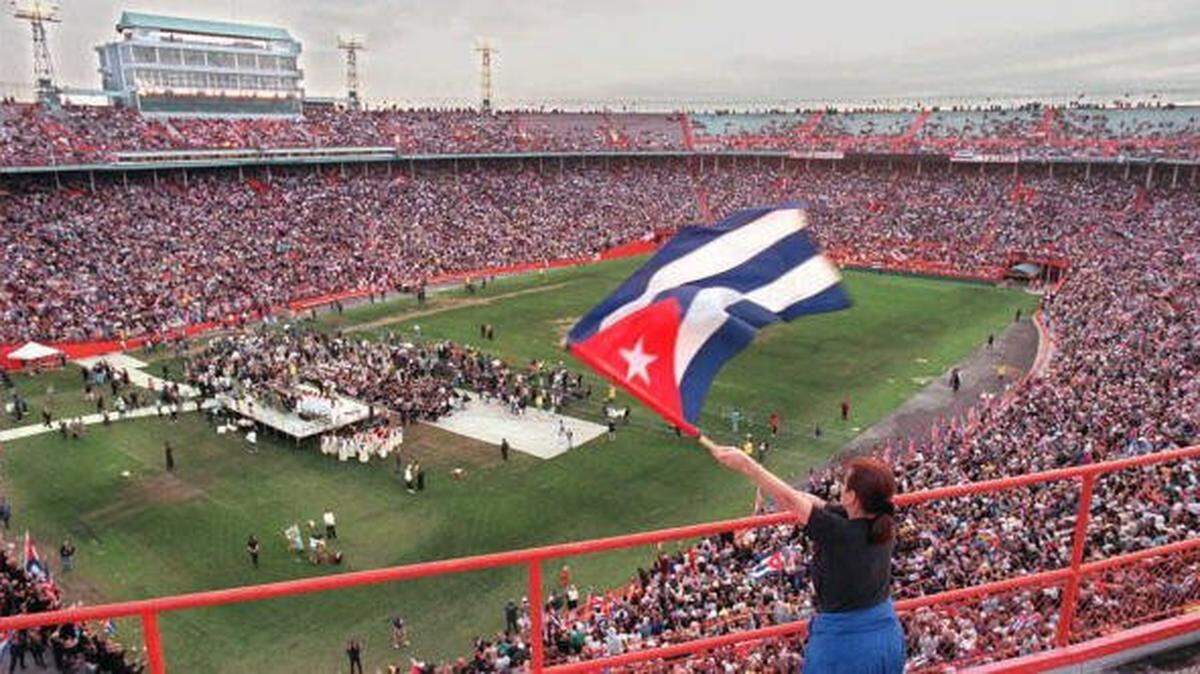 MIAMI, FL - MARCH 2: Cuban-American Nery Danger waves a Cuban flag 02 March as thousands of Cuban-Americans gathered for a rally and ecumenical memorial religious service at the Orange Bowl in Miami, Florida, to commemorate the four "Brothers to the Rescue" pilots who were shot down 24 February by Cuban Migs. AFP PHOTO Chris BERNACCHI (Photo credit should read CHRIS BERNACCHI/AFP via Getty Images)