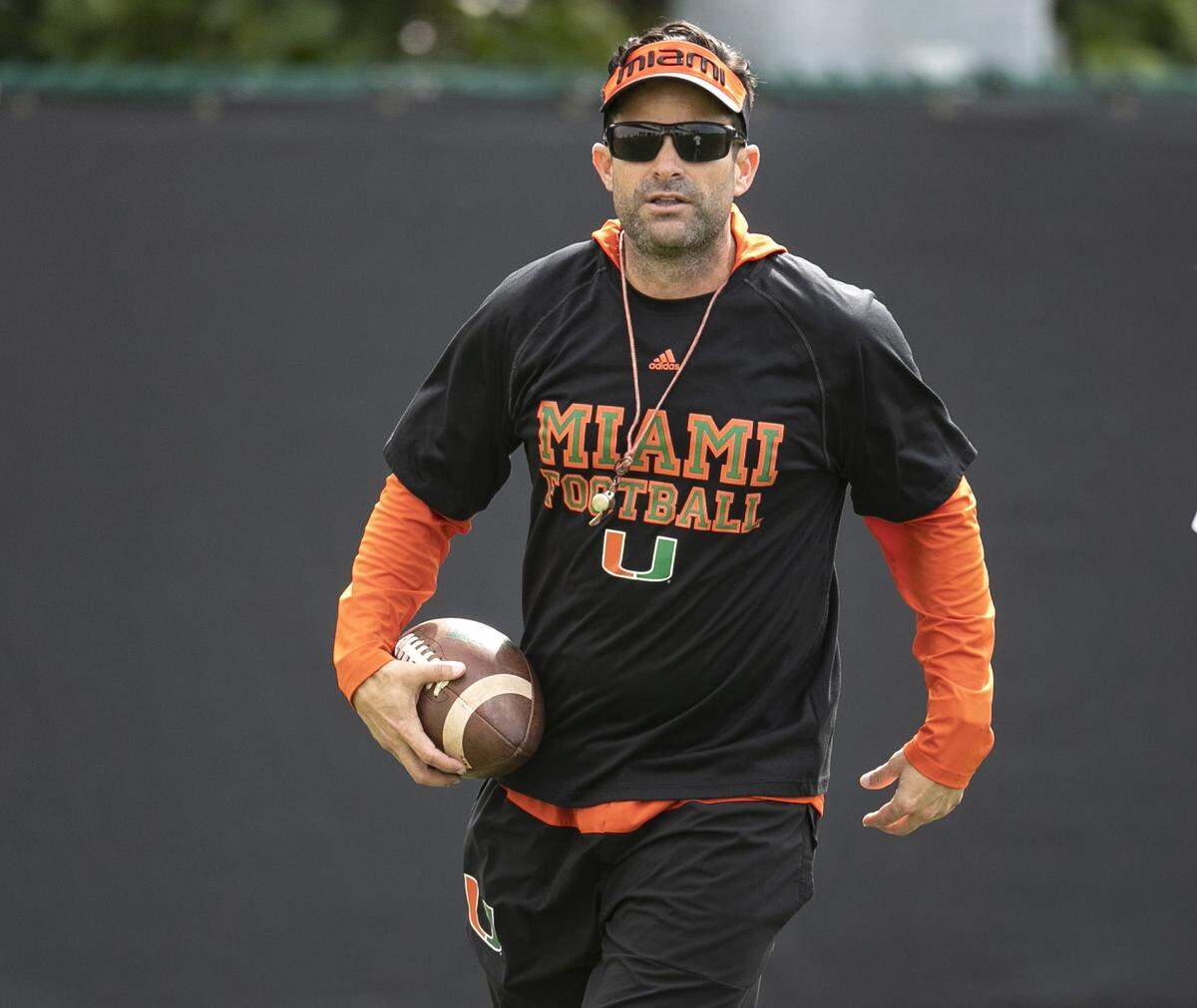 Miami Hurricanes coach Manny Diaz coaches players during spring practice on March 3.