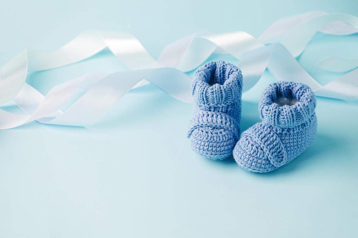 pair of blue knitted baby shoes