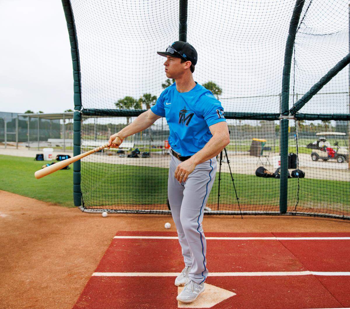 Miami Marlins infielder Joey Wendle bats during batting practice in their spring training workout at Roger Dean Stadium on Tuesday, March 15, 2022 in Jupiter, FL.