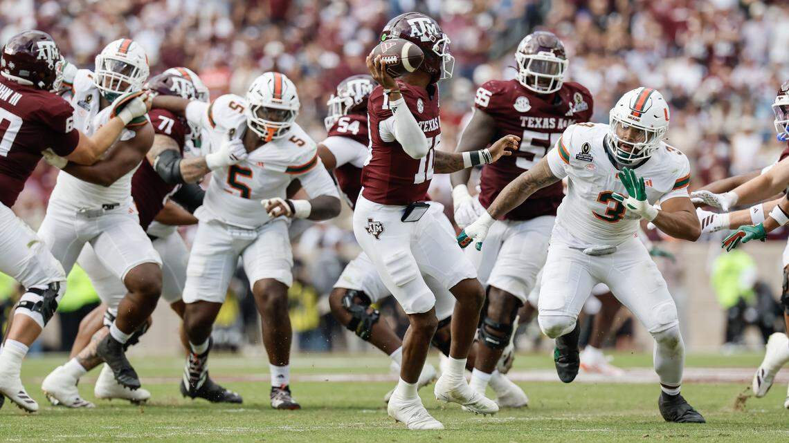 Texas A&M Aggies quarterback Marcel Reed (10) is pressured by Miami Hurricanes defensive lineman Akheem Mesidor (3) and defensive lineman Justin Scott (5) in the second half of the first round of the 2025 College Football Playoff at Kyle Field at College Station, Texas, on Saturday, December 20, 2025.