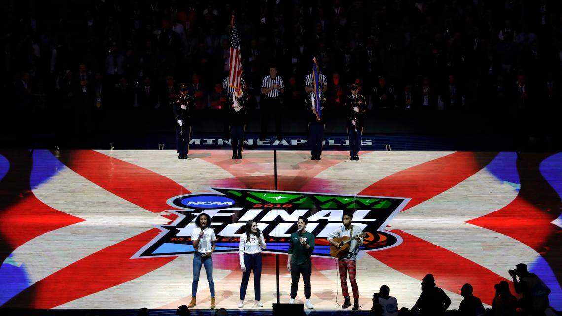 Student athletes perform the national anthem before the semifinals of the Final Four NCAA college basketball tournament between Auburn and Virginia, Saturday, April 6, 2019, in Minneapolis.