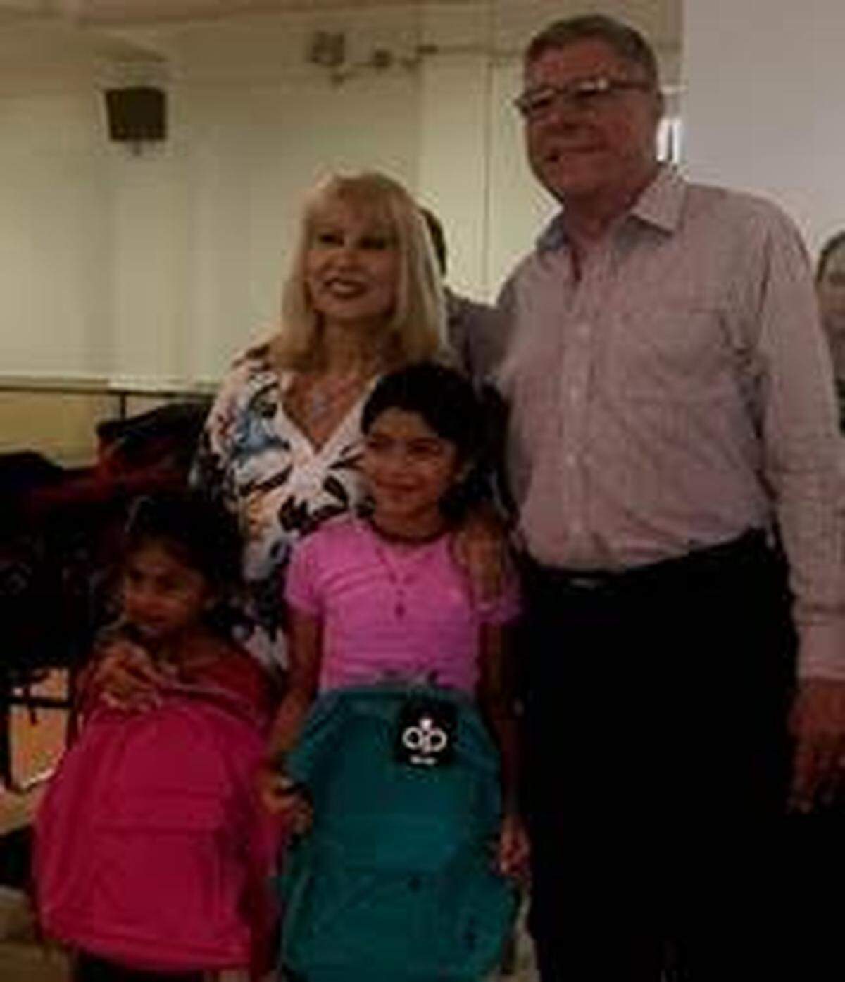 Miami-Dade County School Board Member Mari Tere Rojas, left, with Miami Commissioner Manolo Reyes during her annual back-to-school backpack giveaway at Shenandoah Middle School.
