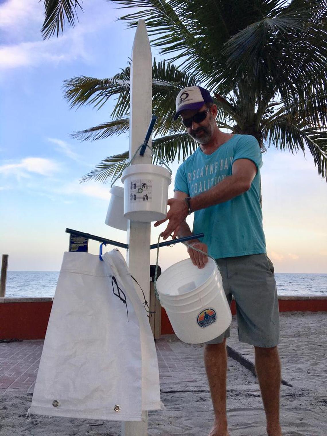 Manny Rionda with one of his Fill-A-Bag prototypes for collecting trash on beaches.