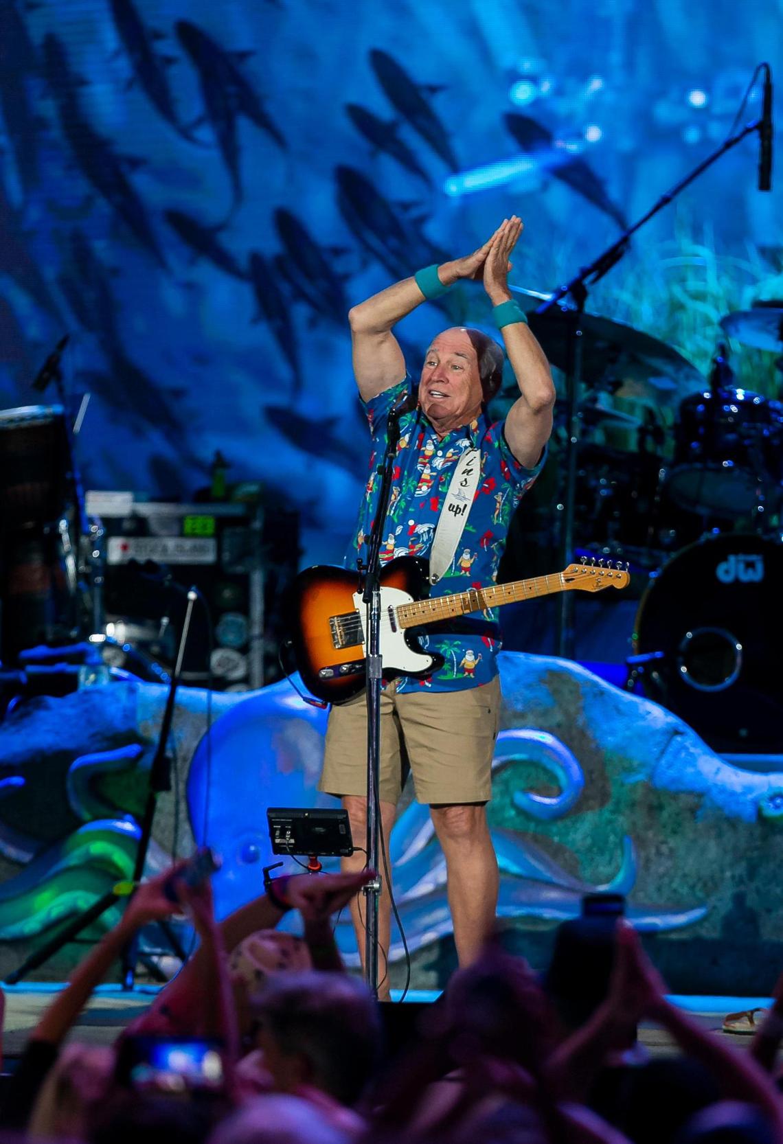 Jimmy Buffett at the iTHINK Financial Amphitheatre in West Palm Beach, Florida on Dec. 9, 2021. Here he performs his signature “Fins” movement.