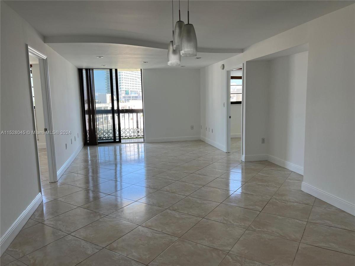 The Normandy Isles apartment’s intracoastal waterway views can be seen from the front door, kitchen, dining and living room space.