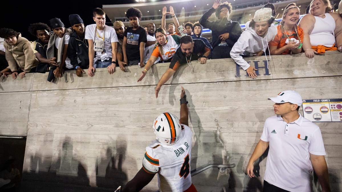 Miami Hurricanes defensive lineman Rueben Bain Jr. (4) celebrates with his teammates after defeating the California Golden Bears in their NCAA college football game at the California Memorial Stadium on Saturday, Oct. 5, 2024, in Berkeley, Calif.