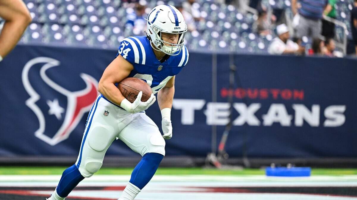 Sep 17, 2023; Houston, Texas, USA; Indianapolis Colts running back Jake Funk (34) carries the ball during warm ups prior to the game against the Houston Texans at NRG Stadium. Mandatory Credit: Maria Lysaker-USA TODAY Sports