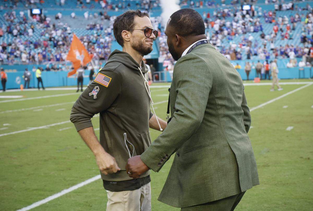 Miami Dolphins head coach Mike McDaniel and General Manager Anthony "Champ" Kelly greet each other after the Dolphiins defeat the Buffalo Bills during the NFL football game at Hard Rock Stadium in Miami Gardens, Florida on Sunday, November 9, 2025.