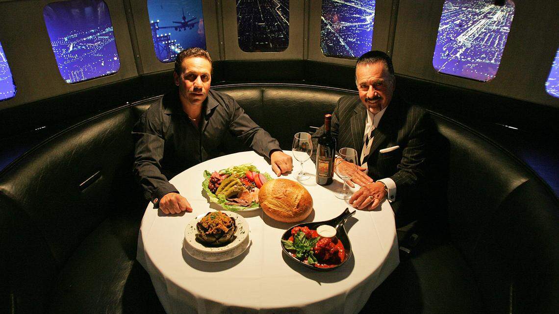 Former Anthony’s Runway 84 owner Anthony Bruno, left, and maitre d’Vincenzo Agostinelli sit down to stuffed artichokes, meatballs and antipasti. The restaurant is closing May 12, 2022 for renovations.