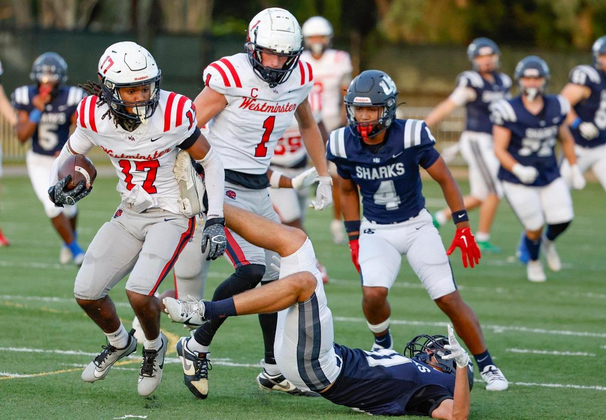 Westminster High School’s defensive back Nathan Graham (17) intercepts the ball during the game against University School at AutoNation Field at the University School campus in Davie, Fl. on Thursday, November 2, 2023.