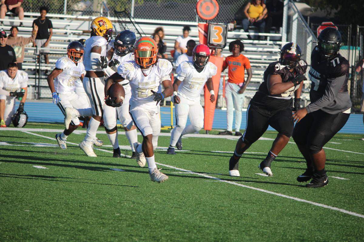 Blanche Ely cornerback Treyvion Gilbert returns a first quarter interception 30 yards, one of two picks the Public All Star team had in the 13th annual Private vs. Public All-Star Game on Saturday at Betty Ferguson Park in Miami Gardens.