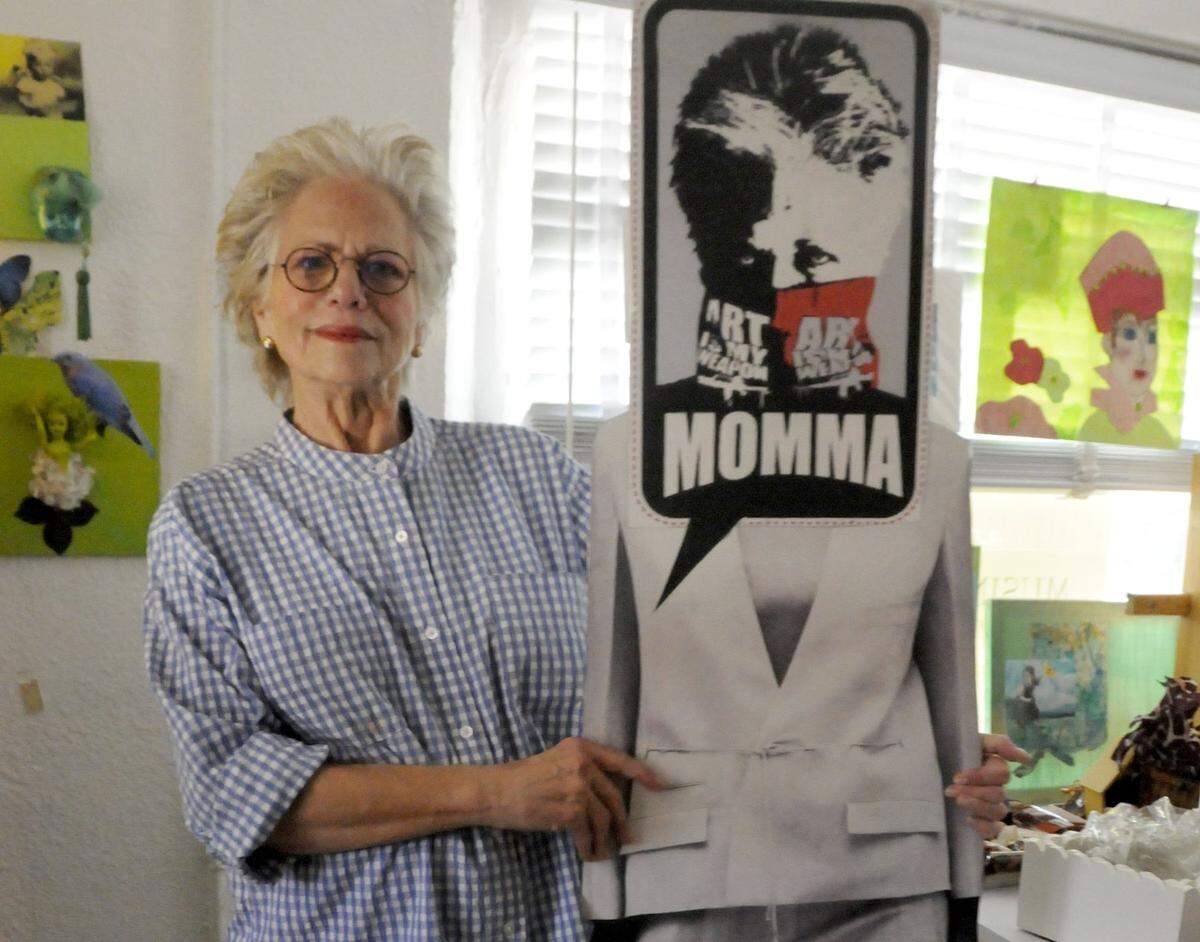 Myra Wexler, aka Yo Momma, an art maven on the Biscayne Corridor, with a life-size poster of herself, was in her studio/gallery, 6900 Biscayne Blvd., in this file photo from Aug. 8, 2012.
