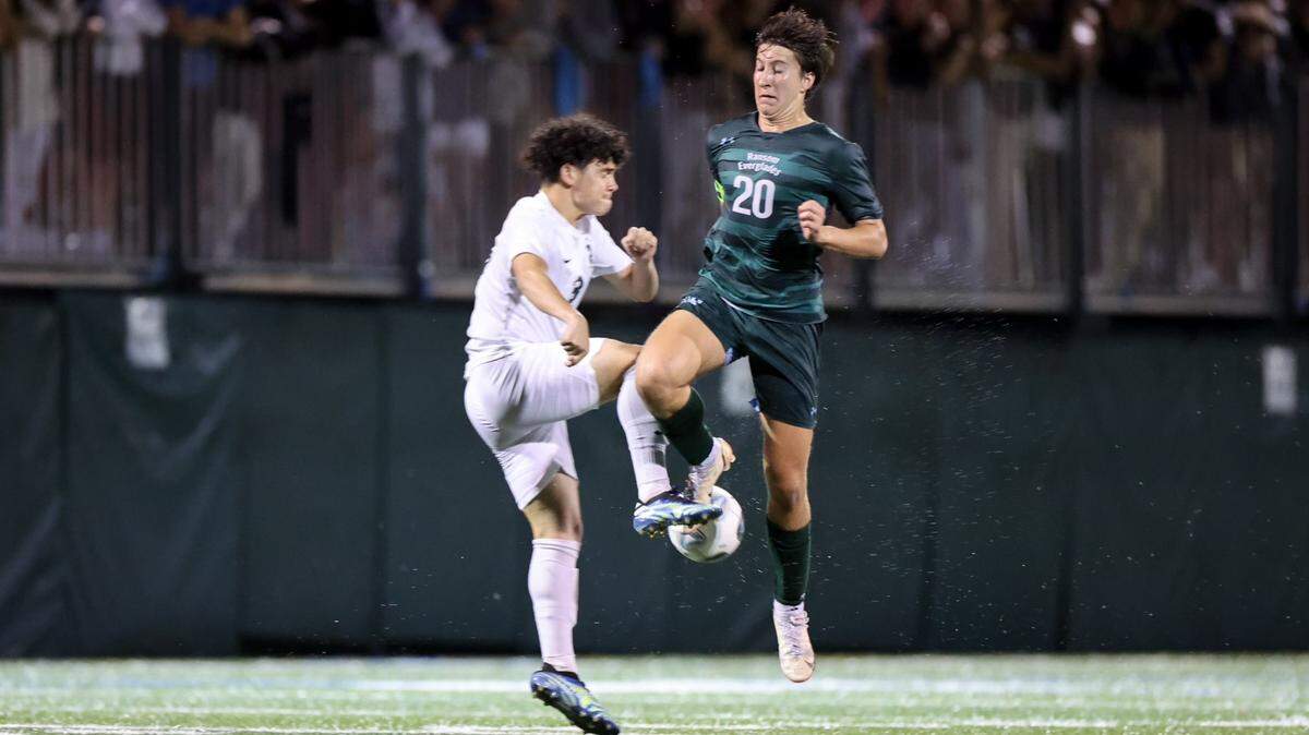 Ransom Everglades senior midfielder Dillan Kaye (20) makes a play on the ball in the Raiders’ regional final win over LaSalle on Wednesday, Feb. 16, 2022.
