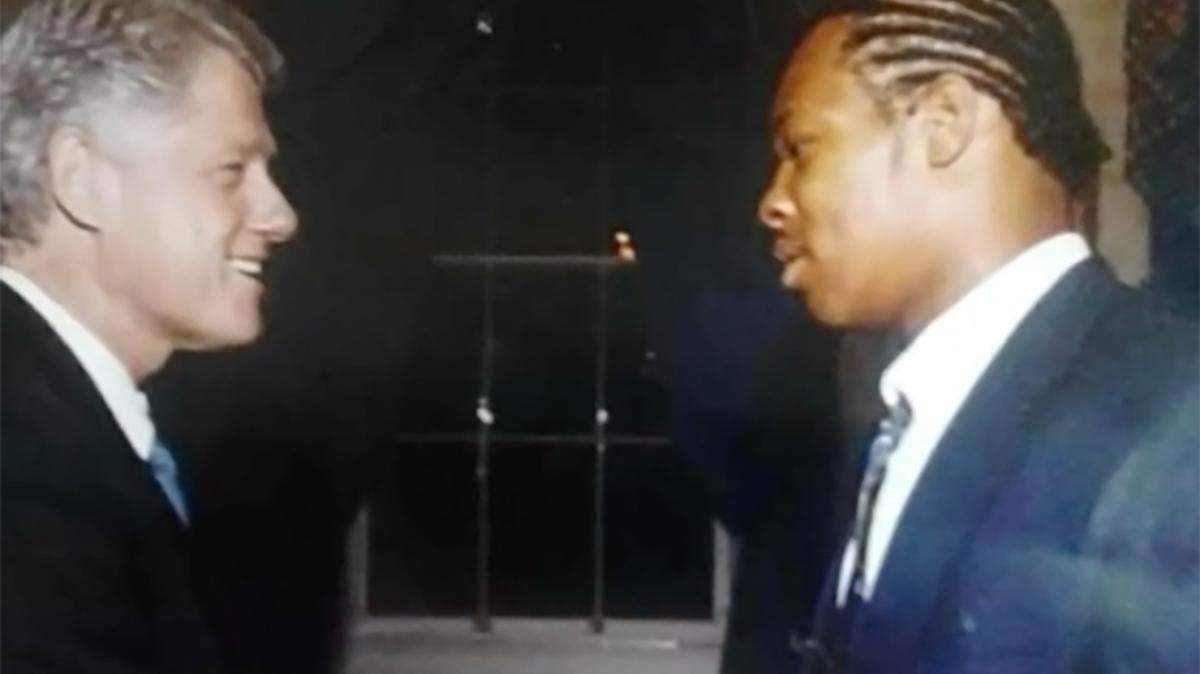 Octavious Jackson, right, with then President Bill Clinton, left, who honored the 1999 national champion Florida State University football team in a White House ceremony on March 2, 2000. Courtesy of CBS 4, Miami