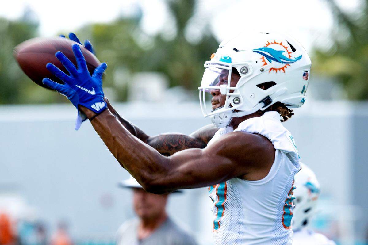 Miami Dolphins wide receiver Erik Ezukanma (87) catches the ball during Dolphins training camp at Baptist Health Training Complex in Miami Gardens on Monday, August 1, 2022.