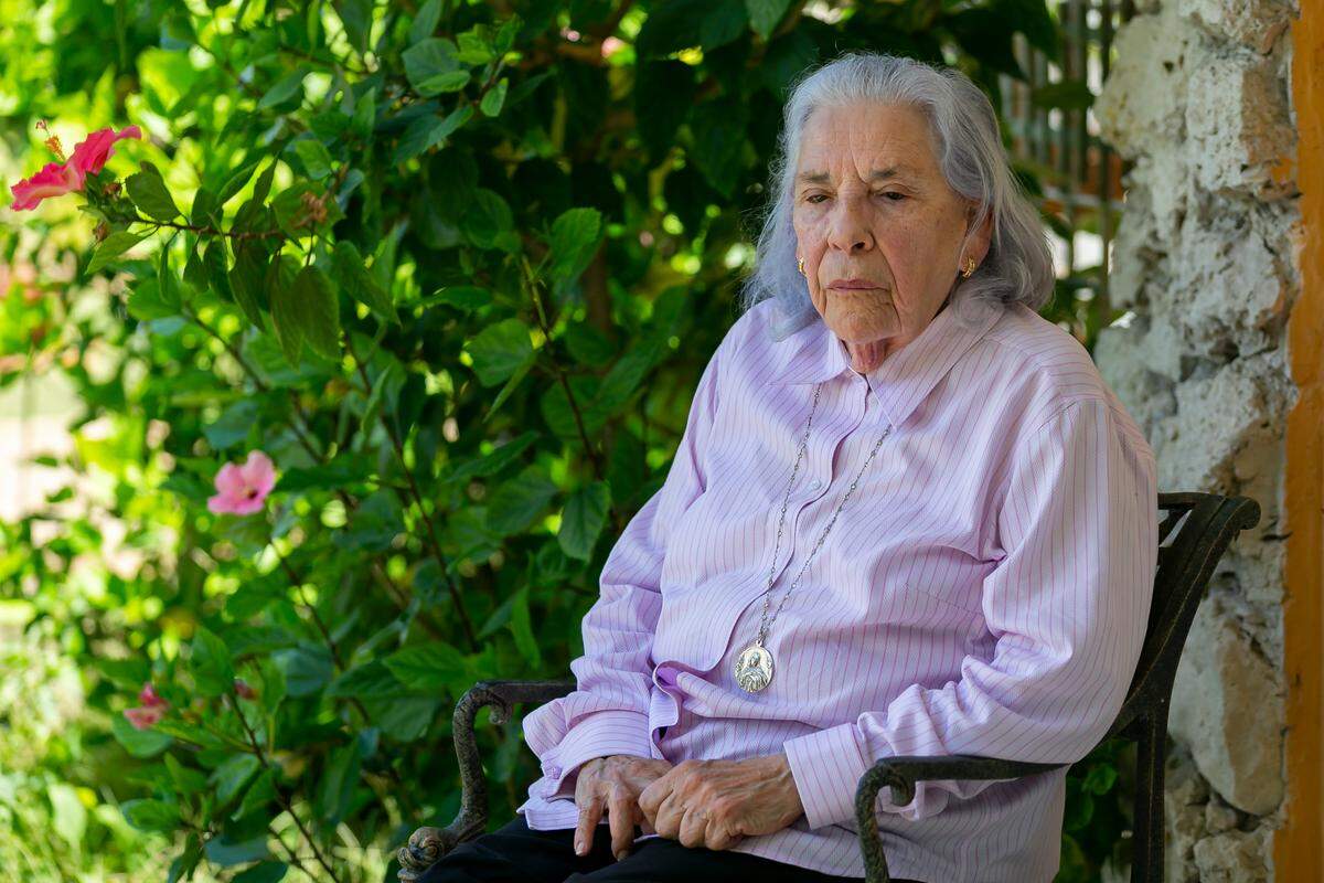 Ana Lazara Rodriguez, 82, sits outside of her home before holding a press conference in Miami, Florida on Thursday, May 6, 2021.