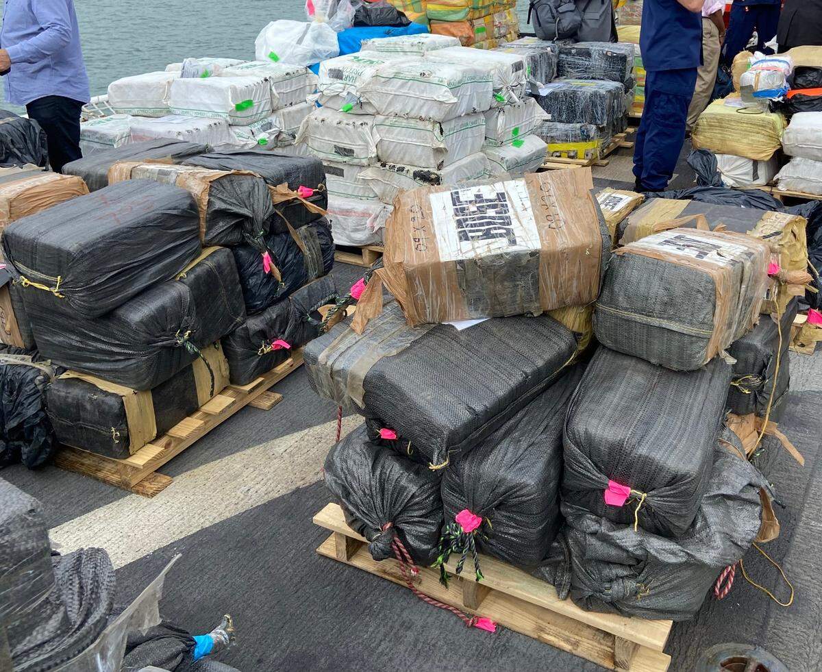 Packages of cocaine and marijuana are stacked on the deck of the U.S. Coast Guard Cutter James Thursday, Feb. 17, 2022.