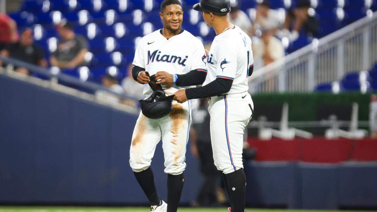Miami Marlins shortstop Xavier Edwards (63) talks to first base coach Jon Jay (11) during the second inning of a baseball game on Wednesday, July 24, 2024, at loanDepot Park in Miami.