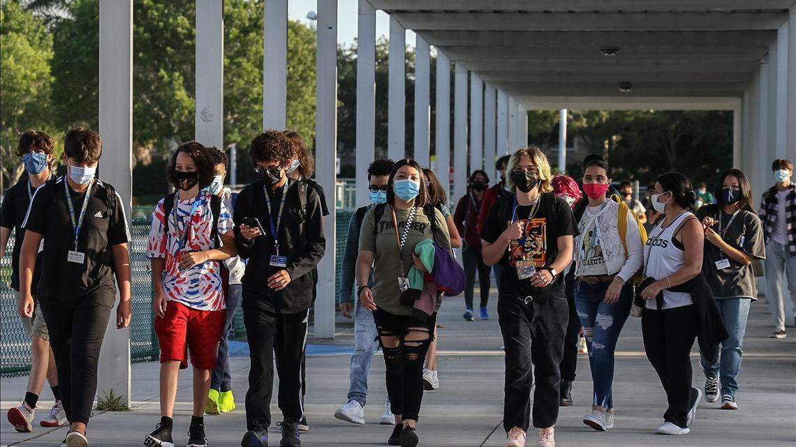 Cypress Bay High School students enter campus in Weston as they returned back to school under a school board mask mandate on Wednesday, August 18, 2021.