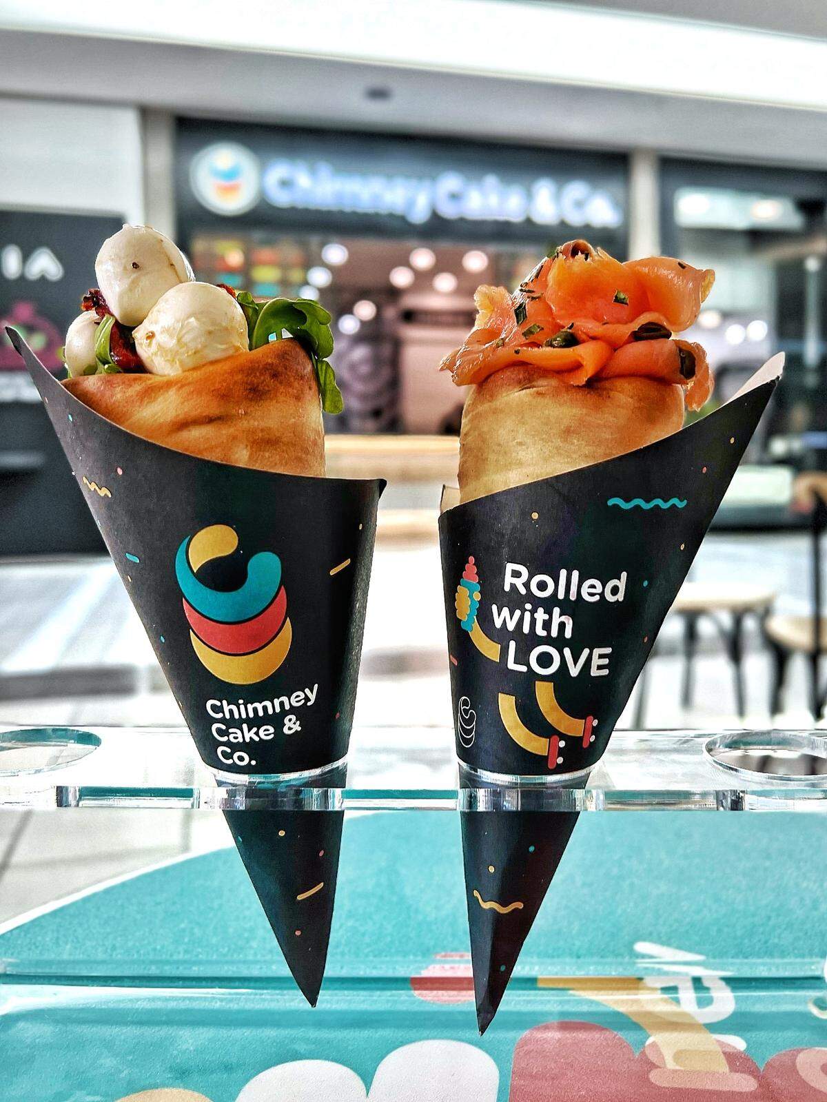 Chimney Cake & Co. offers three savory cakes, including a Caprese-style version and another with salmon and cream cheese.