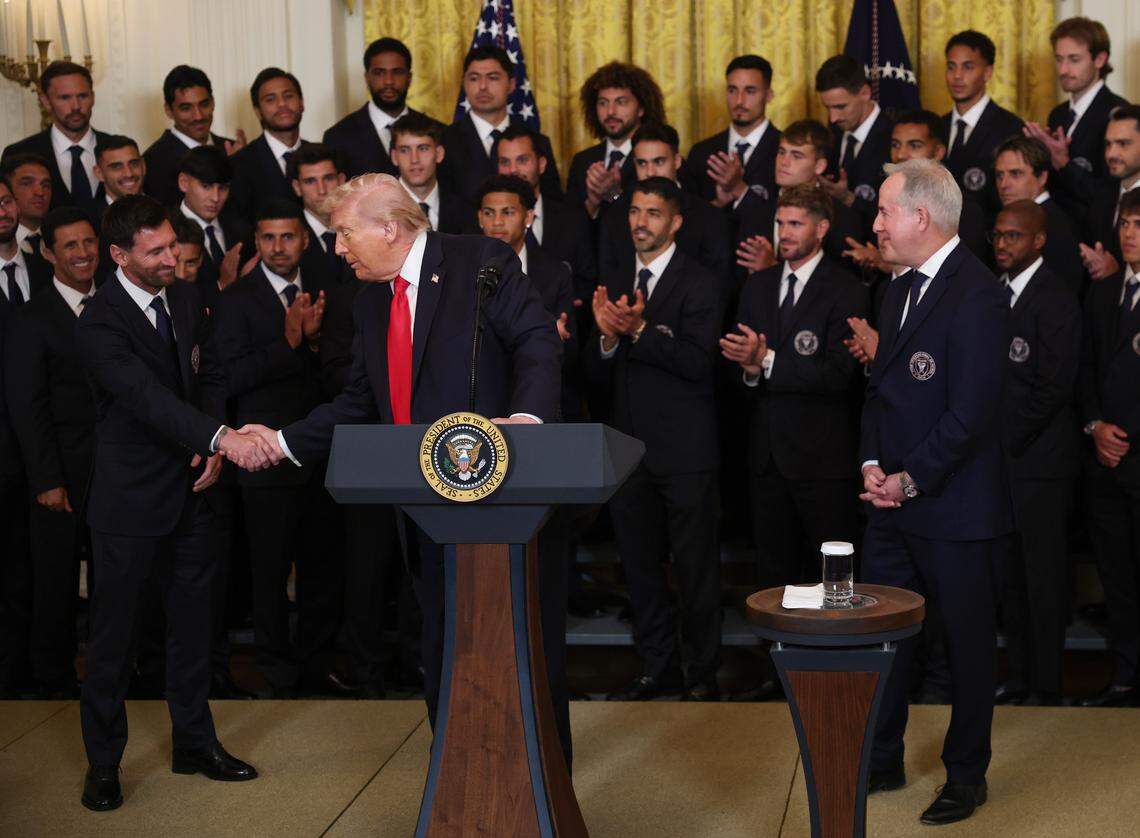 WASHINGTON, DC - MARCH 05: (L-R) Lionel Messi of Inter Miami CF shakes hands with U.S. President Donald Trump as Inter Miami CF CEO and Managing Owner Jorge Mas looks on during an event celebrating the 2025 MLS Cup Champions Inter Miami CF in the East Room of the White House on March 05, 2026 in Washington, DC. Inter Miami defeated the Vancouver Whitecaps 3-1 to win their first MLS Cup championship. (Photo by Win McNamee/Getty Images)