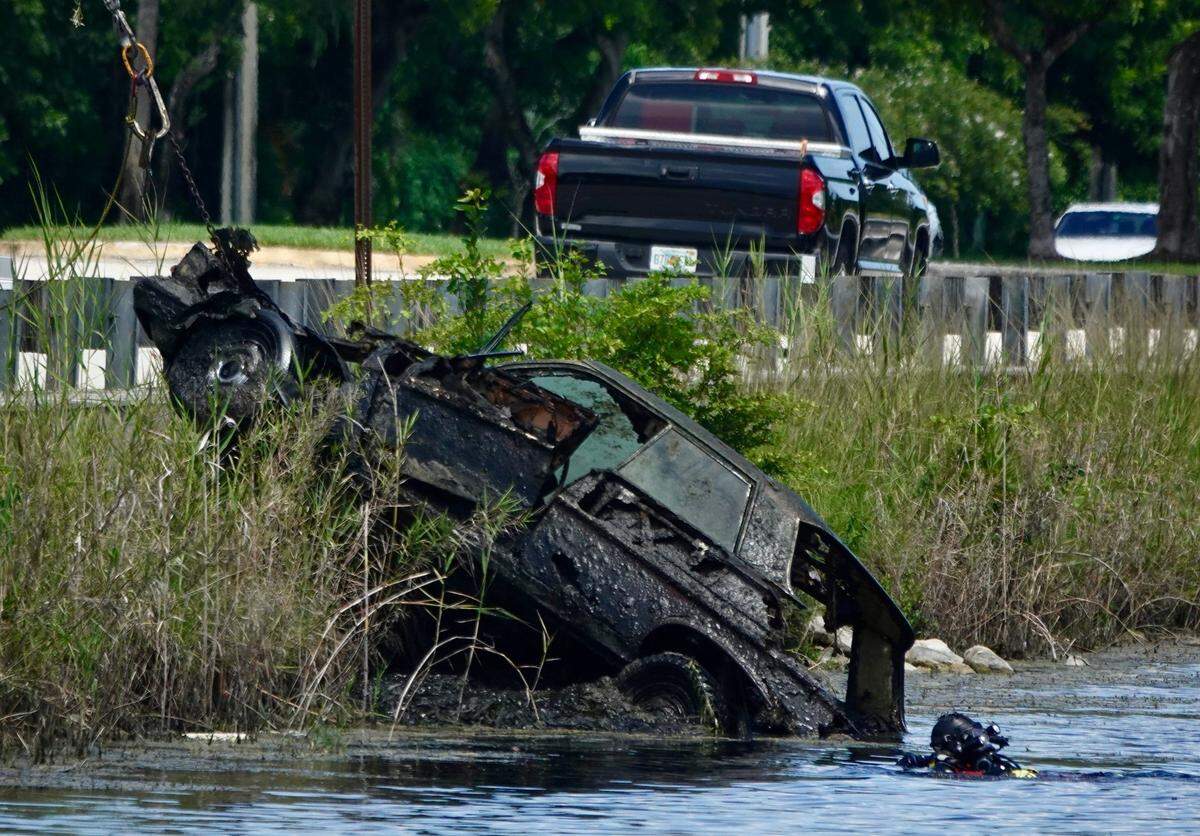 The Broward Police Department’s dive team and medical examiner worked the scene, located at 10151 SW 1st St in Plantation, where a car was found in a canal with skeletal remains of adults and children on Sunday, August 11, 2024.