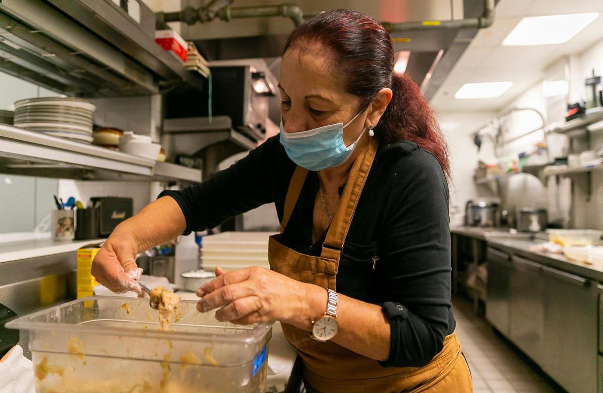 Elsa Lopez, 62, prepares chicken dumplings at Zitz Sum.
