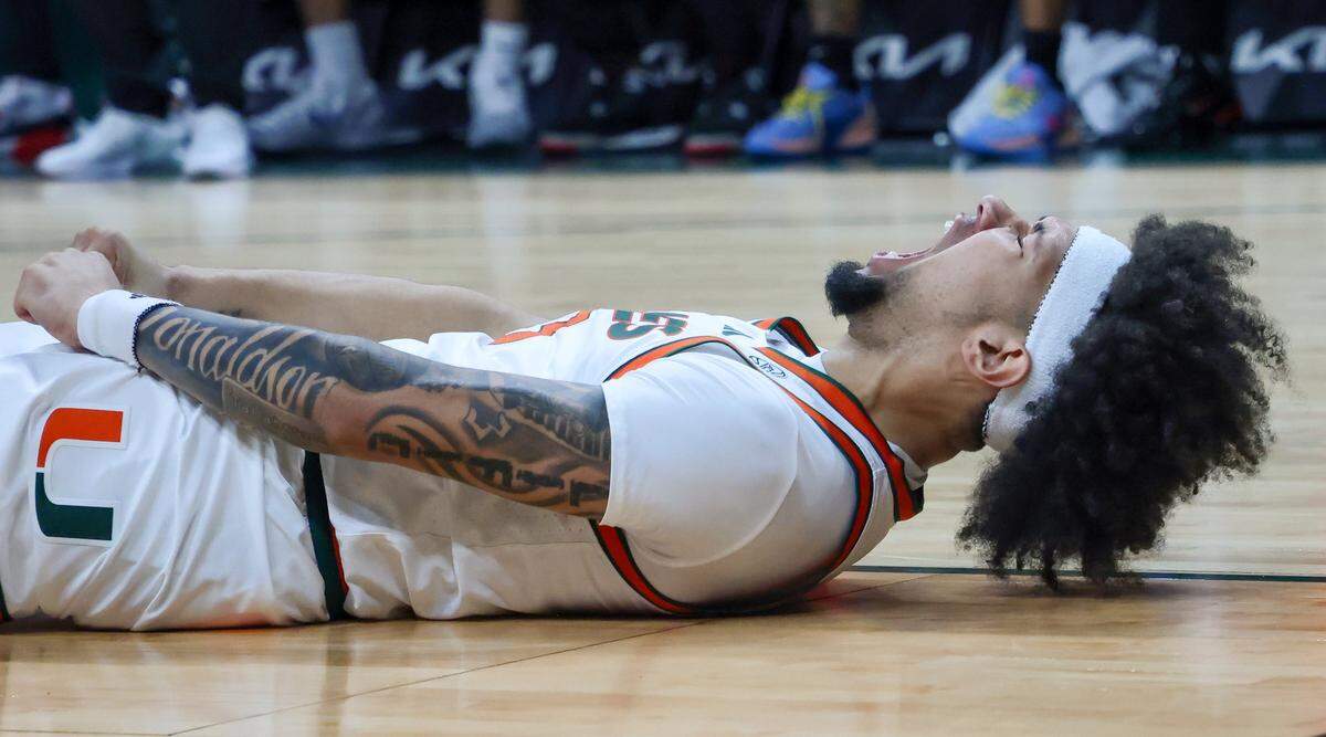 UM player Tre Donaldson lets out primal scream after drawing the foul and scoring for three points as Miami Hurricanes (4-1) played against Delaware State Hornets in the first half at the Watsco Center in Coral Gables, on Sunday, November 23, 2025.