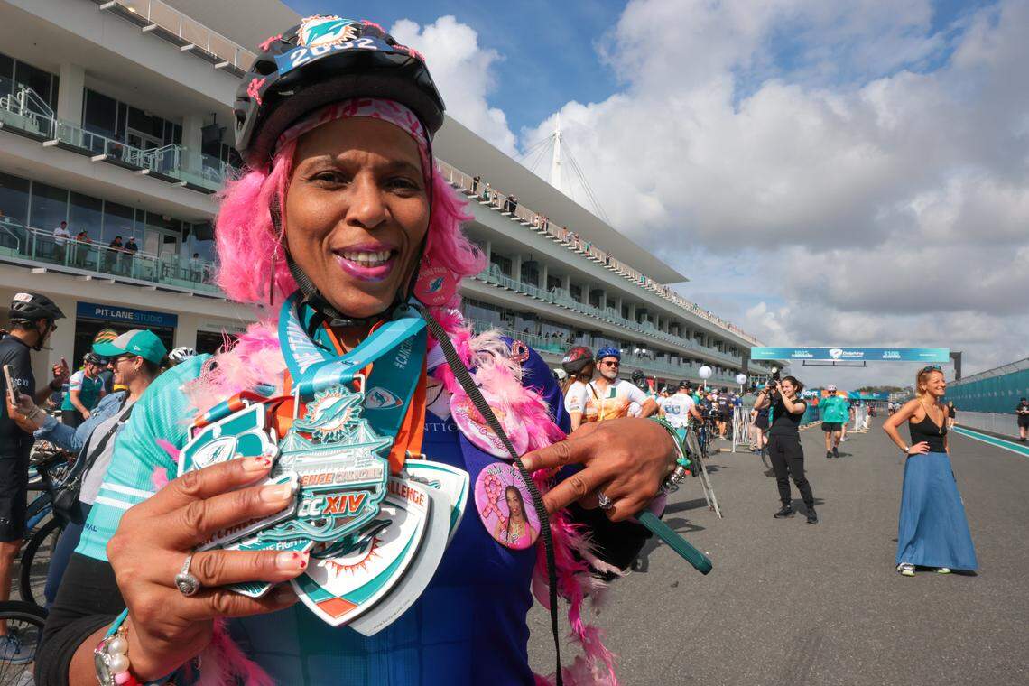 Angelica Green, 54, shows the medals from the nine consecutive Dolphins Cancer Challenge events she has previously attended before the start of the 5K run during the 16th edition of the DCC at Hard Rock Stadium on Saturday, Feb. 28, 2026, in Miami Gardens, Florida.