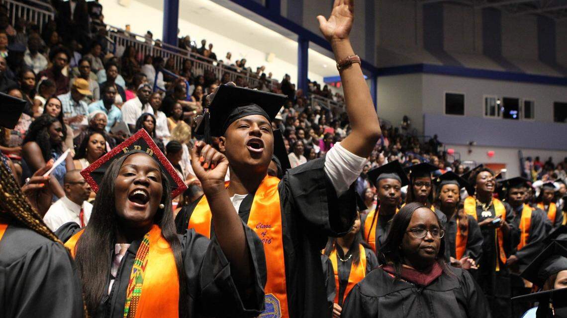 Miami Gardens is home to two universities: St. Thomas and Florida Memorial, where 2018 graduates included Vienisha Barr and Matthew Williamson in this file photo. Many commencements resume in-person in 2021, but with COVID-19 protocols.