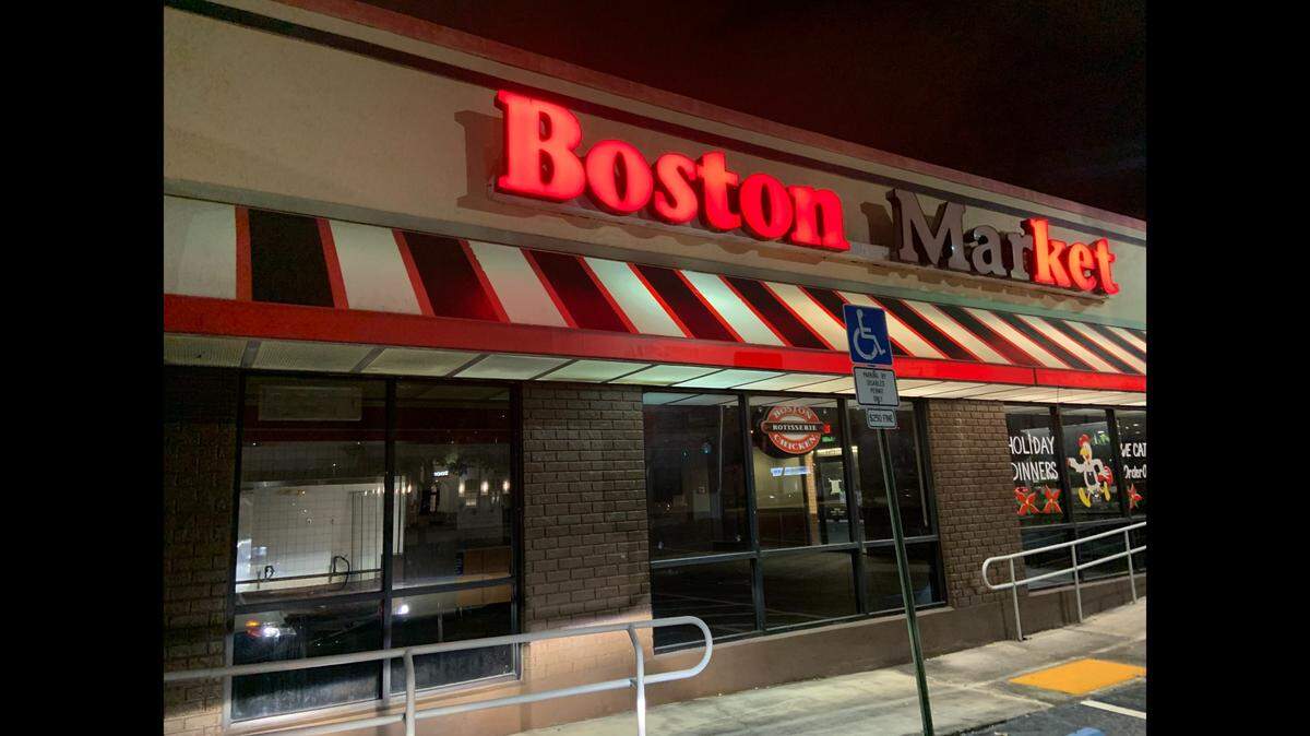 The sign is lit on a Friday night at 1781 E. Commercial Blvd., but the Boston Market was evicted 11 months ago.