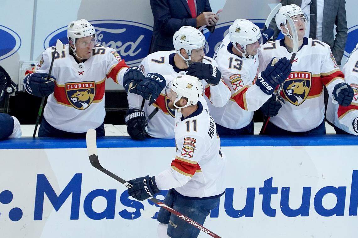 TORONTO, ONTARIO - AUGUST 01: Jonathan Huberdeau #11 of the Florida Panthers celebrates with his teammates after scoring a goal against Semyon Varlamov #40 of the New York Islanders during the third period in Game One of the Eastern Conference Qualification Round prior to the 2020 NHL Stanley Cup Playoffs at Scotiabank Arena on August 1, 2020 in Toronto, Ontario, Canada. (Photo by Andre Ringuette/Freestyle Photo/Getty Images)