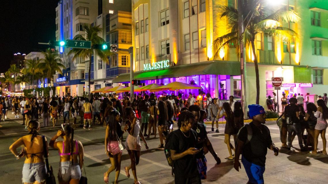 Crowds walk on Ocean Drive during spring break in Miami Beach on March 18, 2023.