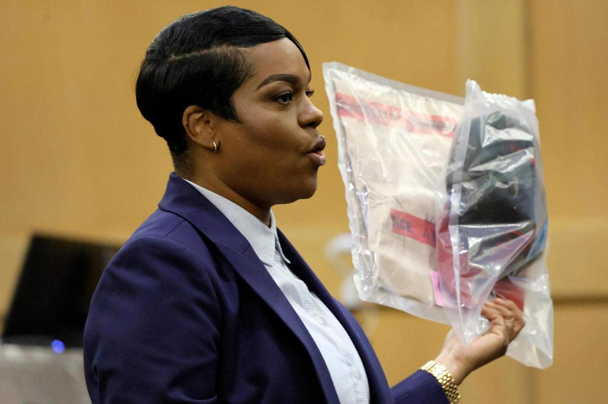 During her closing arguments in the XXXTentacion murder trial, Assistant State Attorney Pascale Achille holds up a camouflage hat with a red brim that was seen worn by shooting suspect Michael Boatwright in multiple surveillance videos included as evidence in the case. This was at the Broward County Courthouse in Fort Lauderdale on Tuesday, March 7, 2023. Emerging rapper XXXTentacion, born Jahseh Onfroy, 20, was killed during a robbery outside of Riva Motorsports in Deerfield Beach in 2018 allegedly by defendants Michael Boatwright, Trayvon Newsome, and Dedrick Williams.