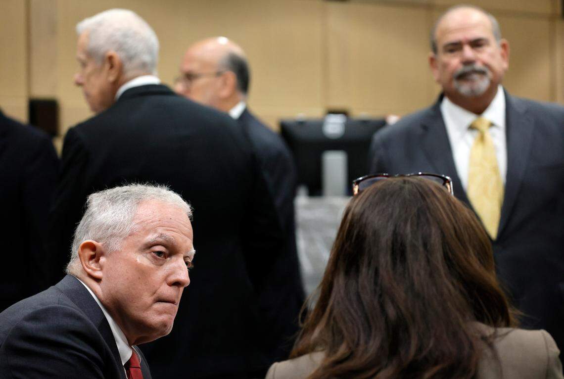 Prosecutors Steven Klinger and Nicole Bloom speak as defense attorneys are shown behind during a recess in a hearing as part of the trial of Jamell Demons, better known as rapper YNW Melly, at the Broward County Courthouse in Fort Lauderdale on Friday, Oct. 6, 2023. (Amy Beth Bennett / South Florida Sun Sentinel)