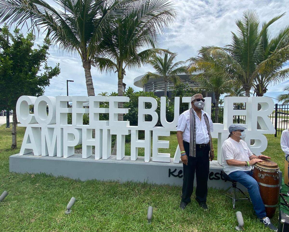 Key West City Commissioner Clayton Lopez, left, and musician Henry Fuller attended a ceremony June 19, 2020, to unveil a sign designating the island’s amphitheater the Coffee Butler Amphitheater, after the local musician.
