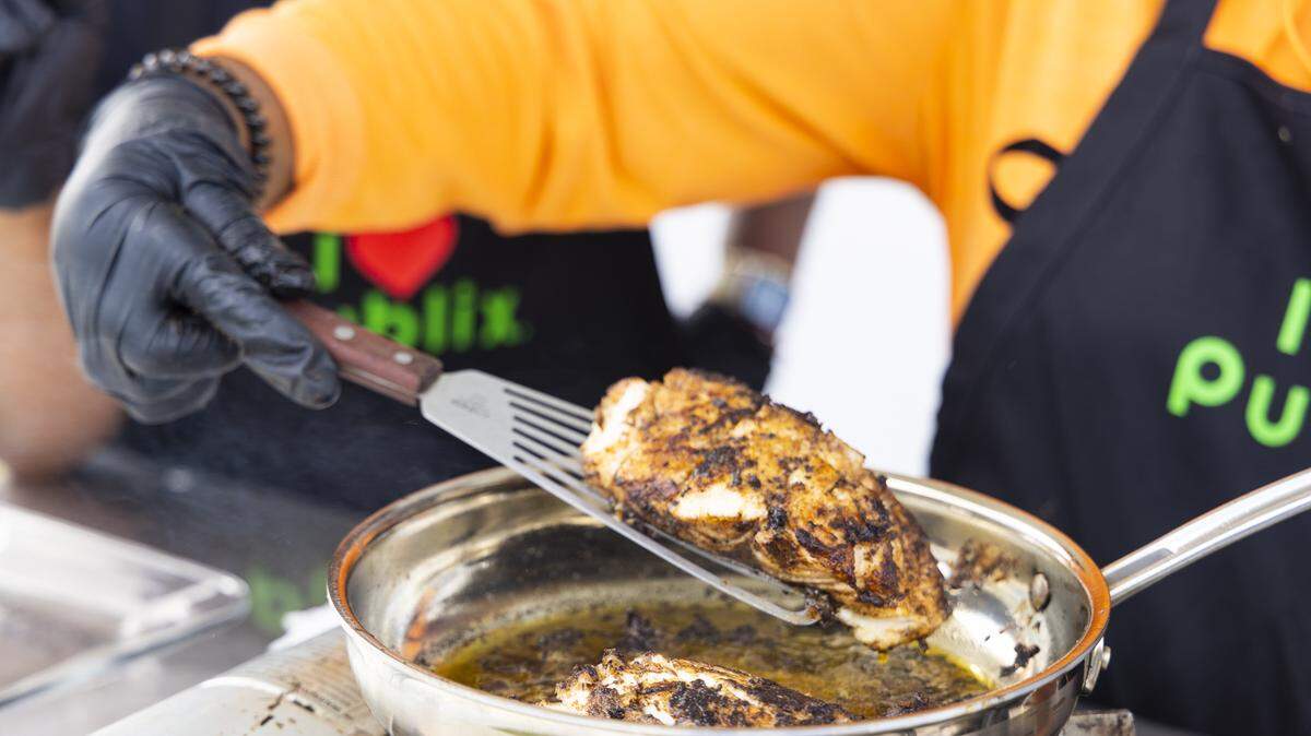 A chef prepares food at the 2023 Grace Jamaican Jerk Festival in Miramar.