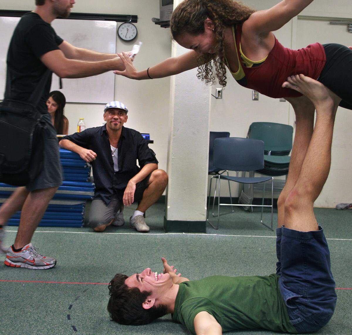 Pulitzer Prize winning playwright Nilo Cruz, center, follows the actors action -from left- Ryan Phillips, Alanna Saunders and Joey arreiro, during a rehearsal of his early play ‘Night Train to Bolina’ that his also directing at University of Miami, where he is a scholar in residence this fall.