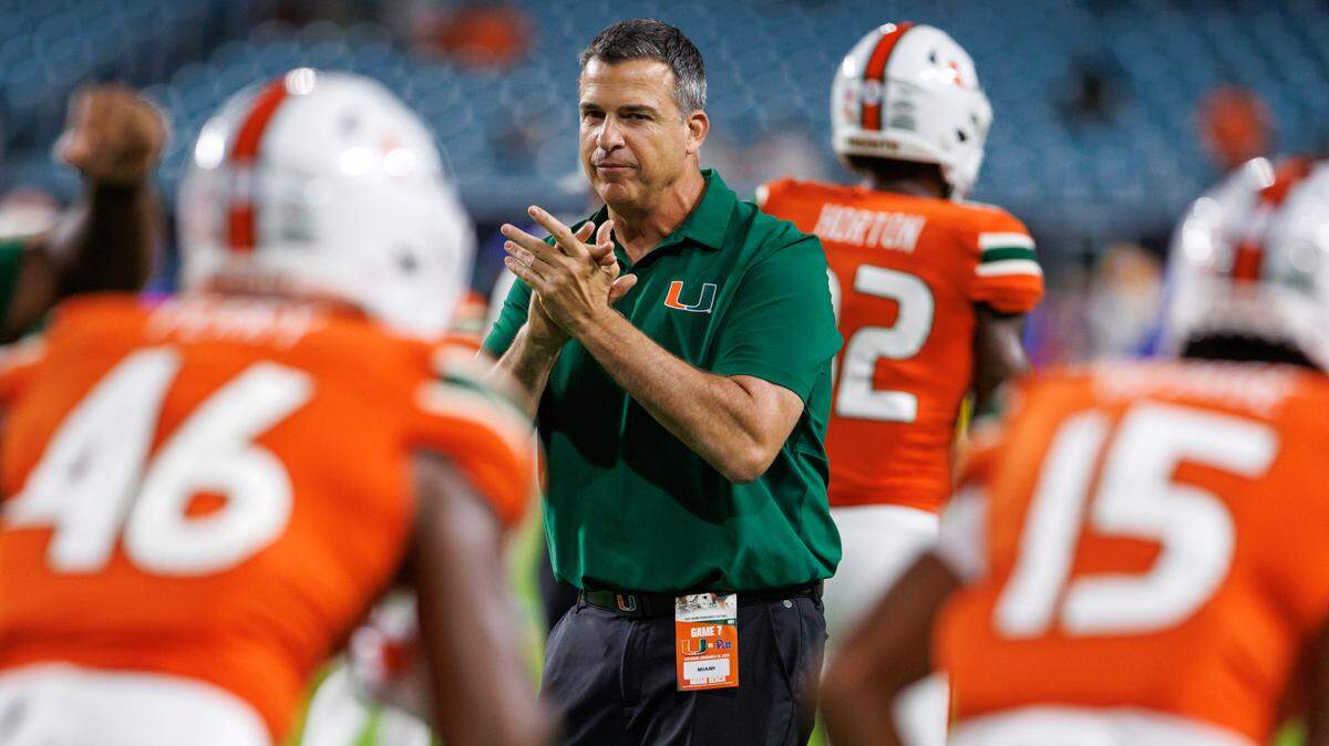 Miami Hurricanes head coach Mario Cristobal give instructions to his team during pregame warmups before the start of an ACC conference football game against the Pittsburgh Panthers at Hard Rock Stadium on Saturday, November 26, 2022 in Miami Gardens, Florida.