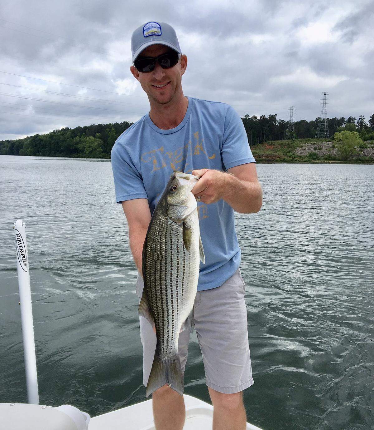 PGA Tour pro Vaughn Taylor  with a striped bass that he caught in the Savannah River. Taylor was fishing for stripers in 2015 when his bass boat took on water, forcing him to jump into the river.