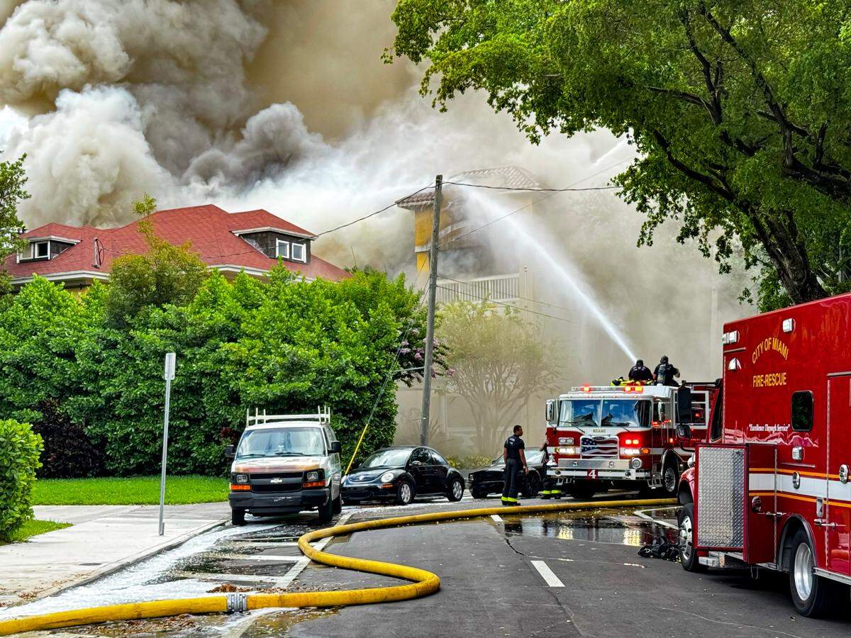 Miami Fire Rescue and Miami police working at the scene of the fire at the Temple Court Apartments, 431 NW Third St.