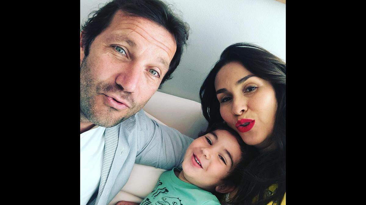 Raquel Oliveira, her husband Alfredo Leone and son Lorenzo are pictured in this photo from June 2019 posted on her Facebook page. Her husband and son are missing in the Champlain Towers condo collapse on June 24, 2021.