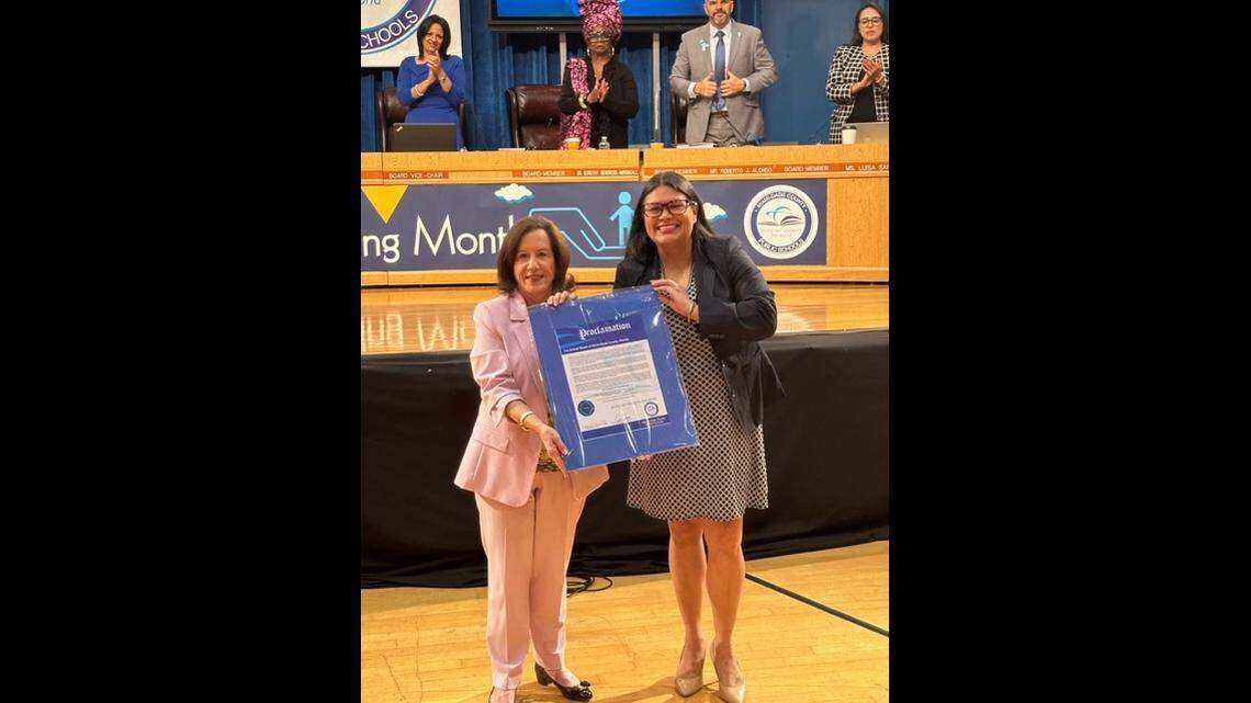 Enid Weisman was presented with a proclamation at the January School Board meeting by Lucia Baez-Geller in recognition of 47 years of service at Miami-Dade County Public Schools.